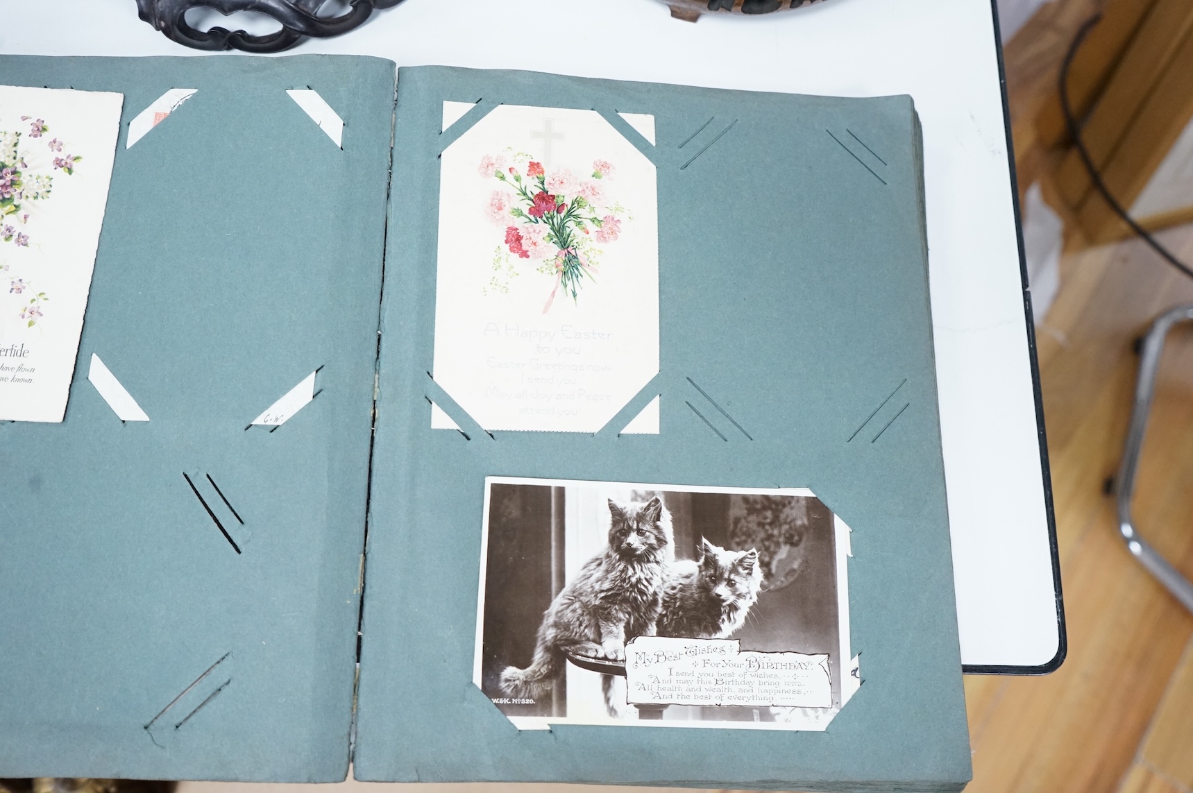 A postcard album to include greetings cards and topographical examples